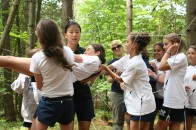 20080714064 Campers pass one of their own through the spider's web