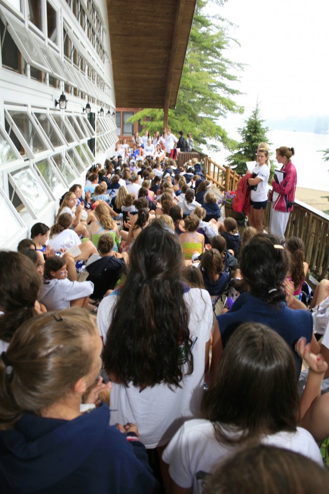 20080720169t Campers listen to announcements on the front porch of the dining hall