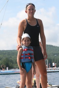 A waterfront counselor with camper