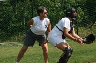 A key staff member acting as umpire at a softball game