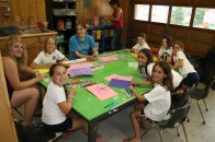 A busy craft table in Point O'Pines Arts & Crafts building