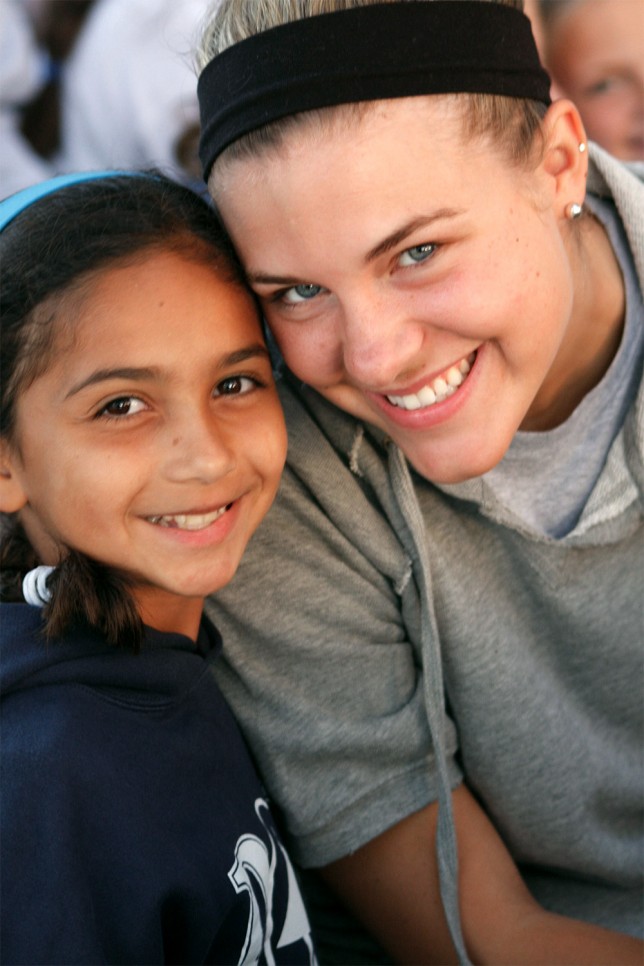 20090629118t A young camper and her college age counselor at Point O'Pines Camp for Girls