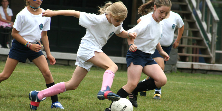 Two girls go toe-to-two for possesion of the soccer ball