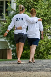 Two summer staff members walking together