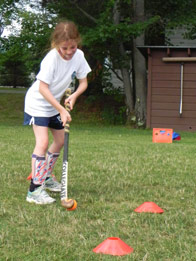 A camper practicing her dribbling