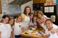 201007283468 Campers gathered in the kitchen for cooking class