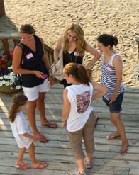Alumnae visiting on the back porch of the dining hall