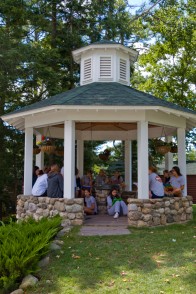 Campers practicing for team sing in a gazebo