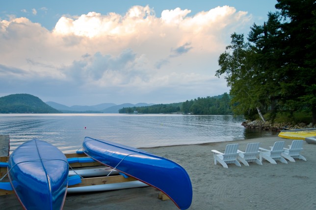 201008105380 Canoes docked on the beach at Brant Lake