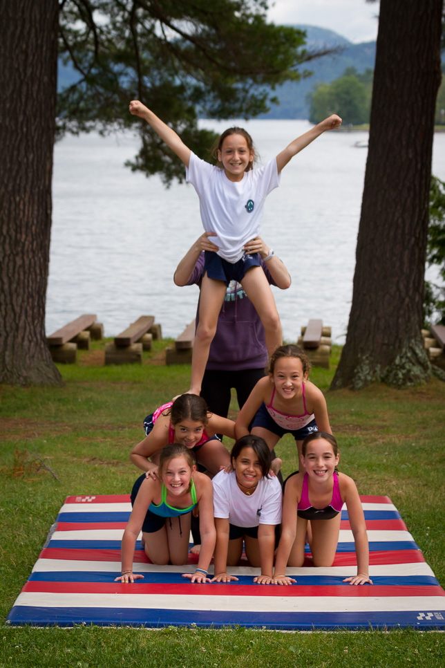 201107018499 Campers make a pyramid at gymnastics