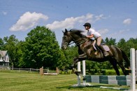 Camper practicing horse jumping 