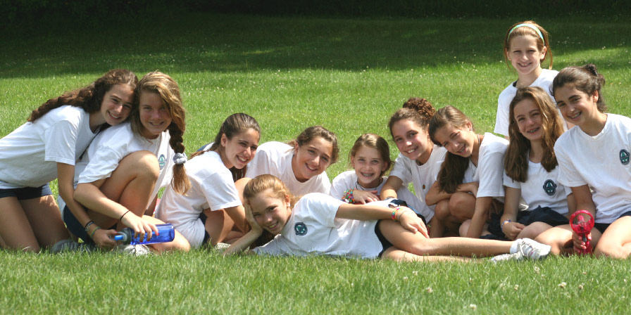 Campers resting in the grass