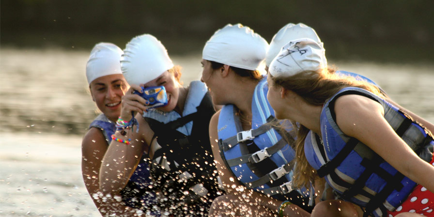Campers posing for a candid shot on the lake