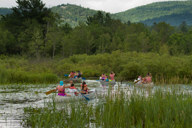 Campers canoeing to the Point O'Pines farm.
